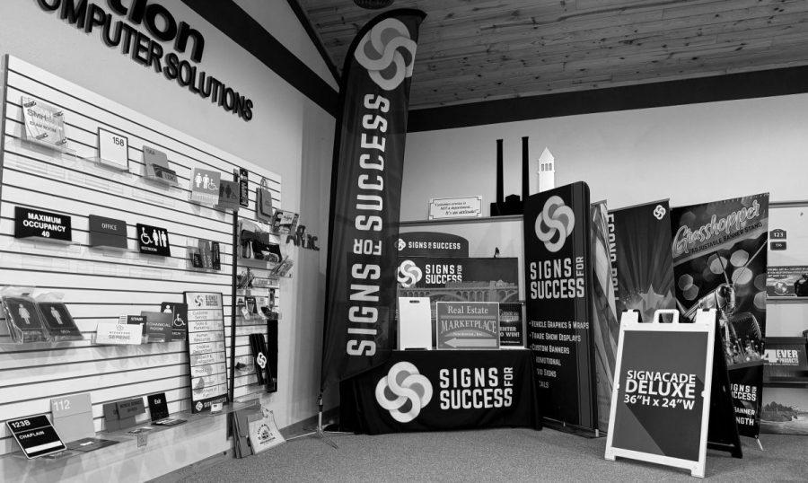 Signs for Success showroom in Spokane displaying ADA signs, banners, and trade show displays